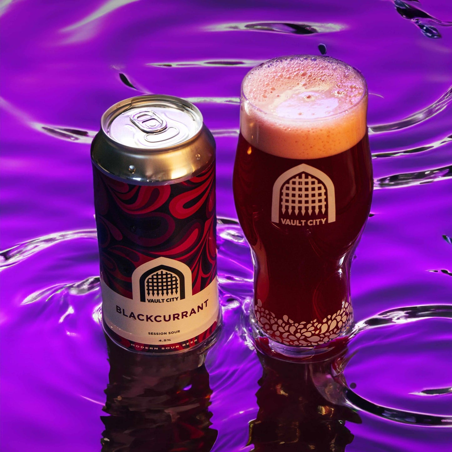 Vault City Blackcurrant Session Sour beer can and glass with dark purple liquid background.