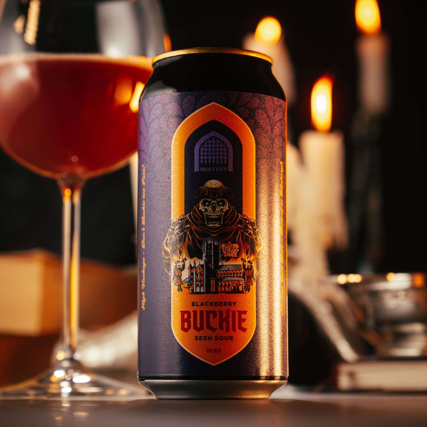 Blackberry Buckie Sesh Sour beer can with wine glass and candles in background