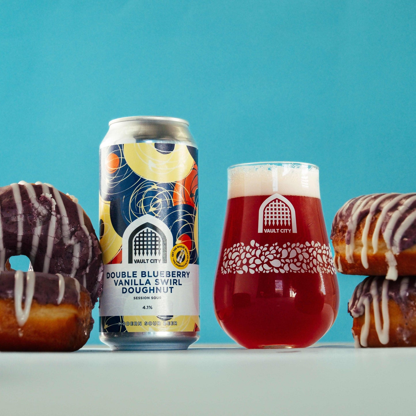 Vault City Double Blueberry Vanilla Swirl Doughnut dessert sour beer can with a glass of deep purple brew and blueberry doughnuts