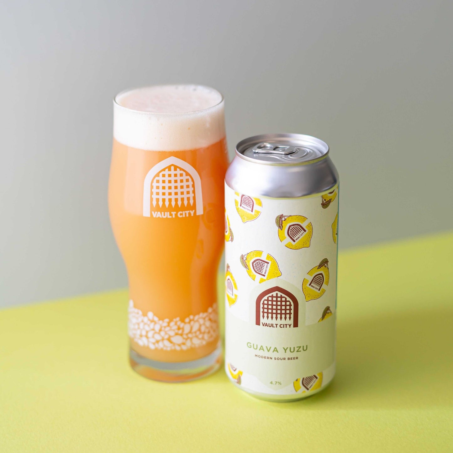 Guava Yuzu session sour beer can and filled glass showcasing vibrant, fruit-forward flavors with a citrussy tartness.