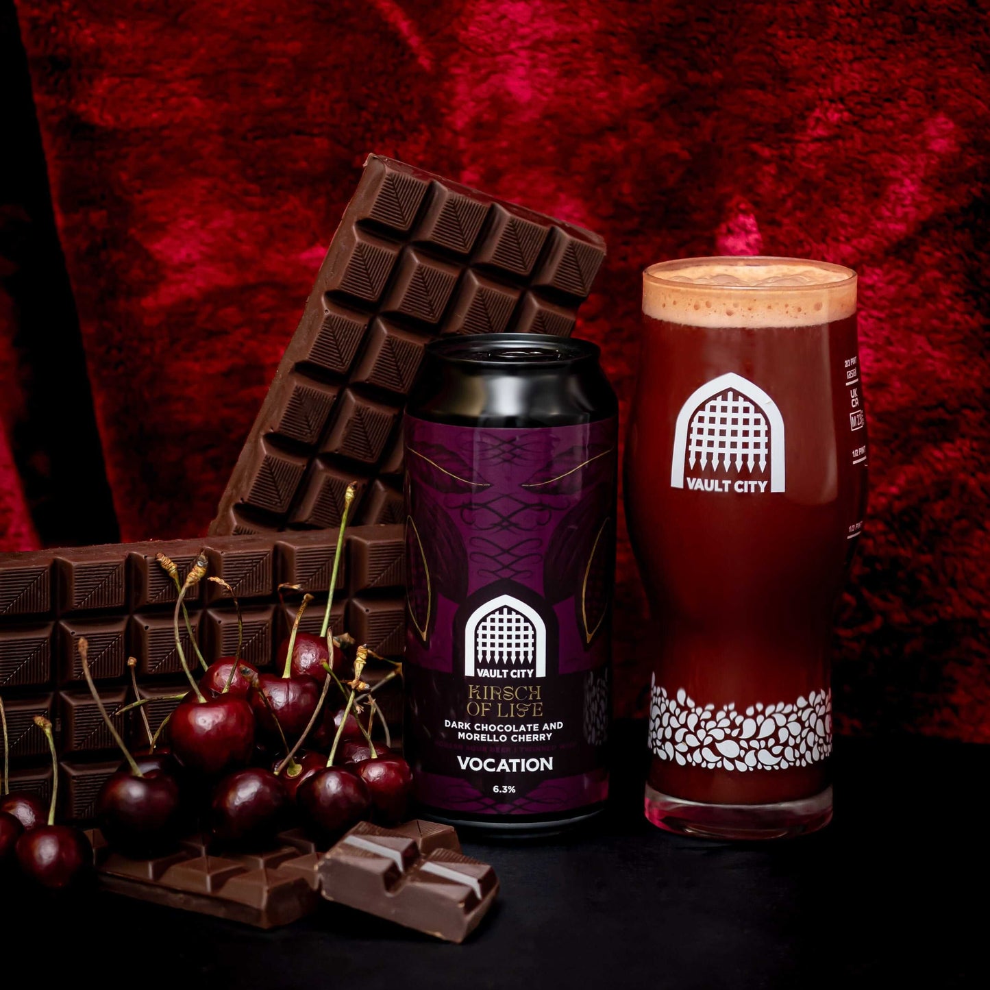 "Kirsch of Life dark chocolate and Morello cherry sour beer by Vault City and Vocation with chocolate bars and cherries"