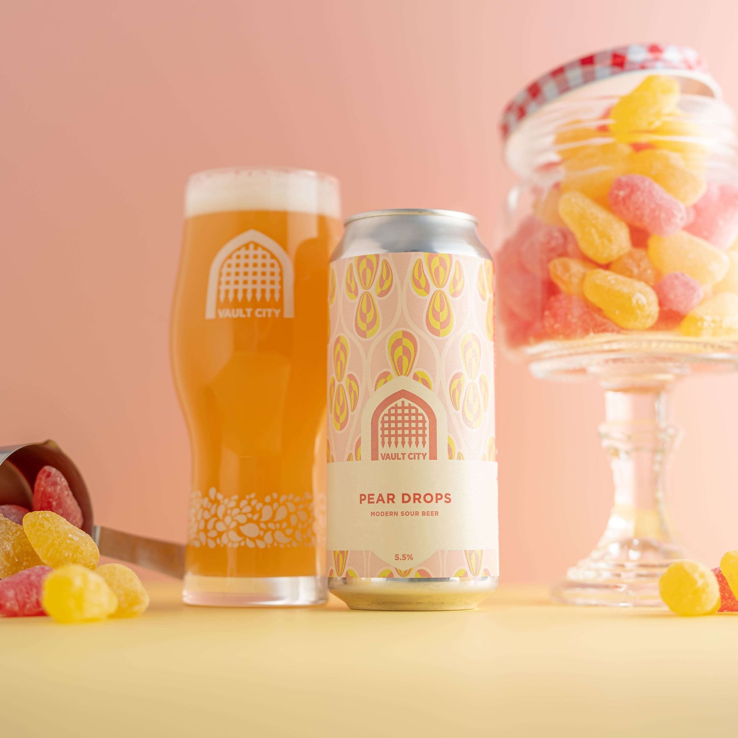 Mixed fermentation base beer with pear drops flavor and lemon sherbet character, shown with glass of beer and jar of hard-boiled pear drops.