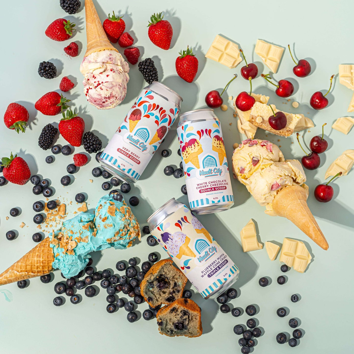Scoop Trio Bundle - Dessert sours inspired by ice cream, featuring cones, berries, and white chocolate, with three colorful cans.
