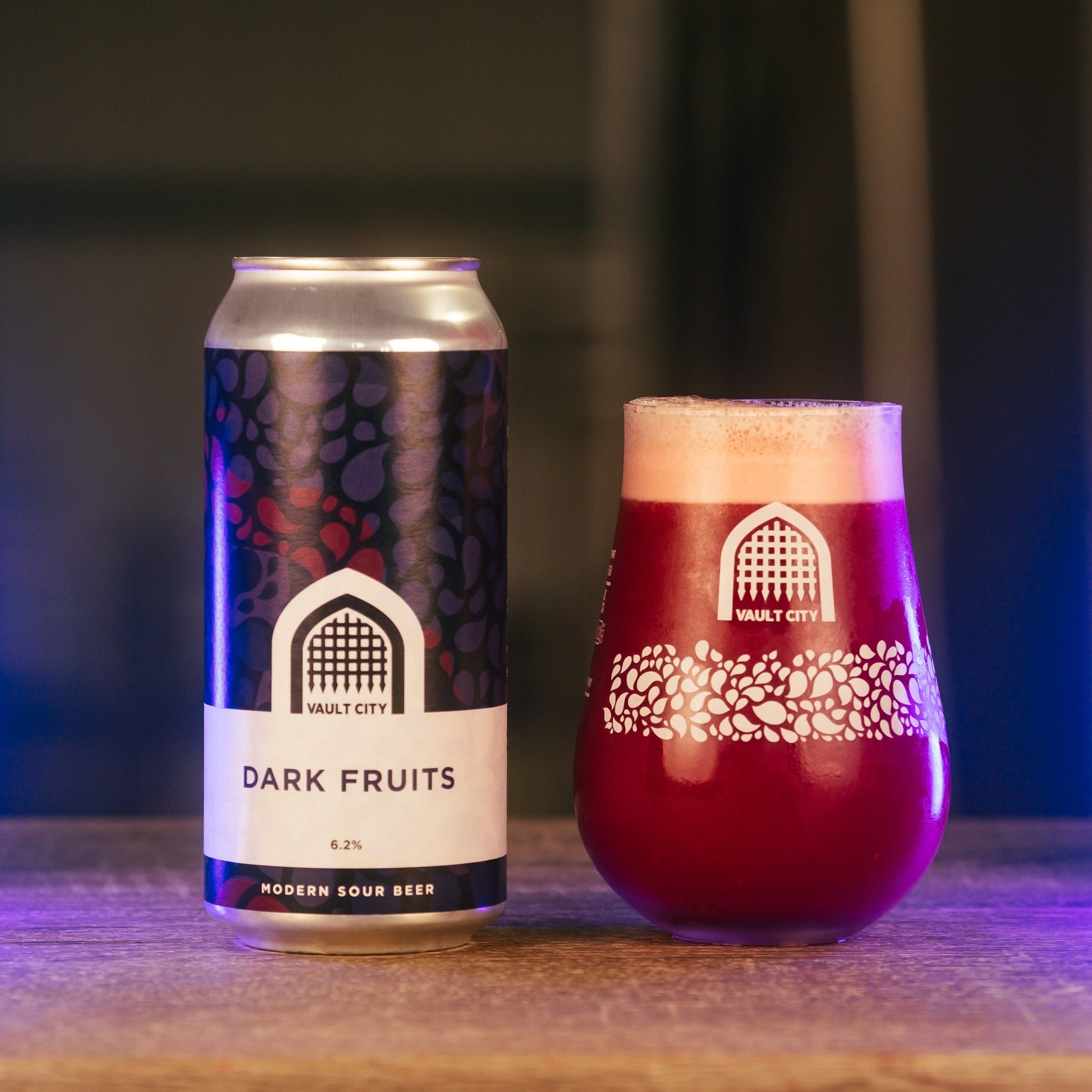 Can and glass of Vault City's Dark Fruits sour beer with Scottish blackcurrants and blackberries, 6.2% ABV, vegan friendly, 440ml.