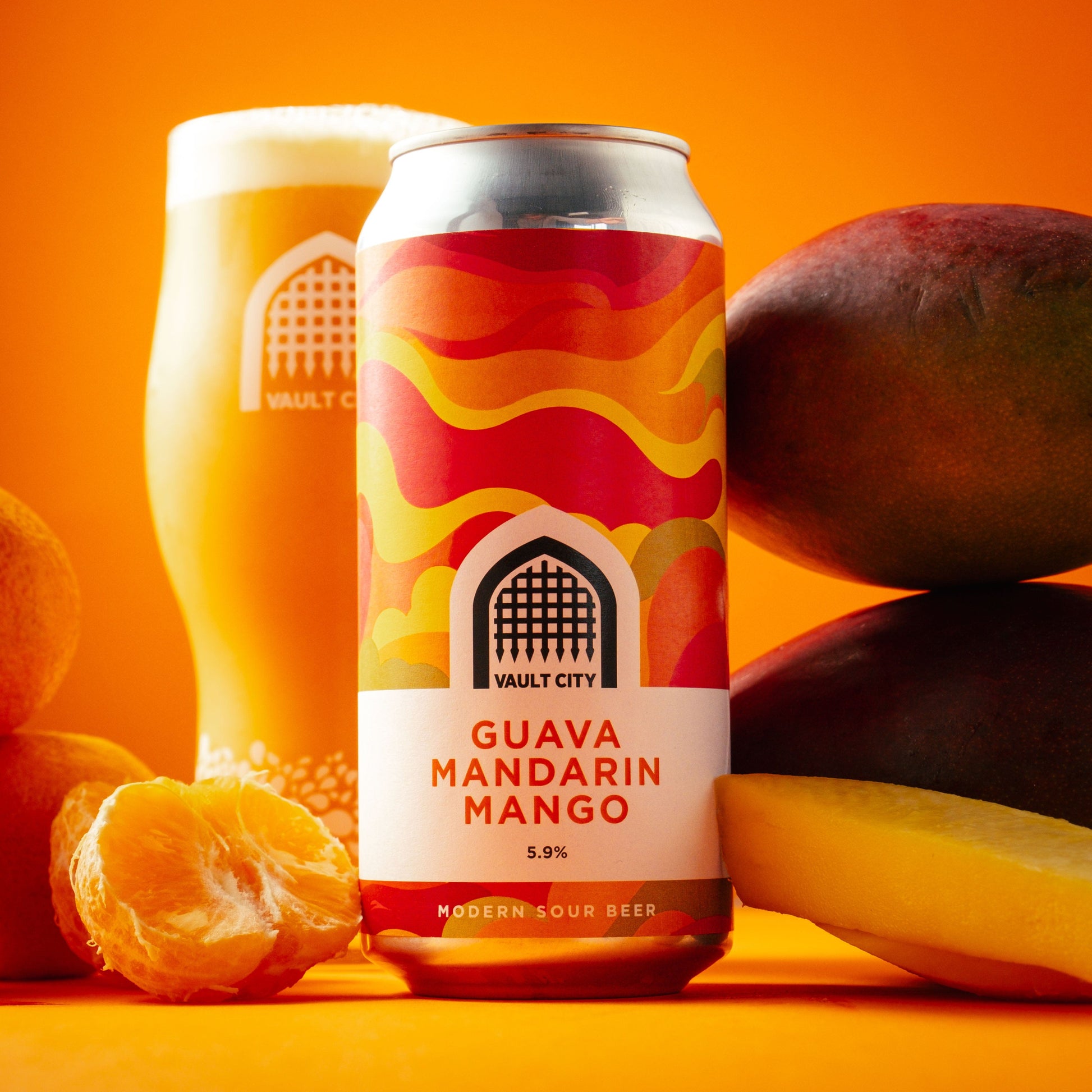 Tropical Guava Mandarin Mango modern sour beer with fresh fruits in background