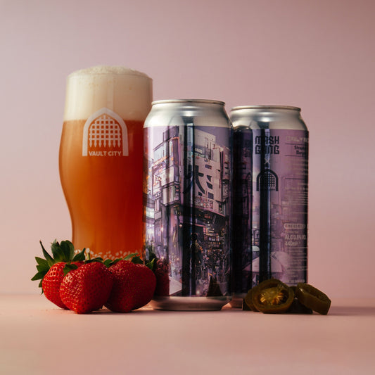 Vault City Strawberry & Jalapeno Margarita Pickleback beer cans with glass, fresh strawberries, and jalapeno slices on pink background