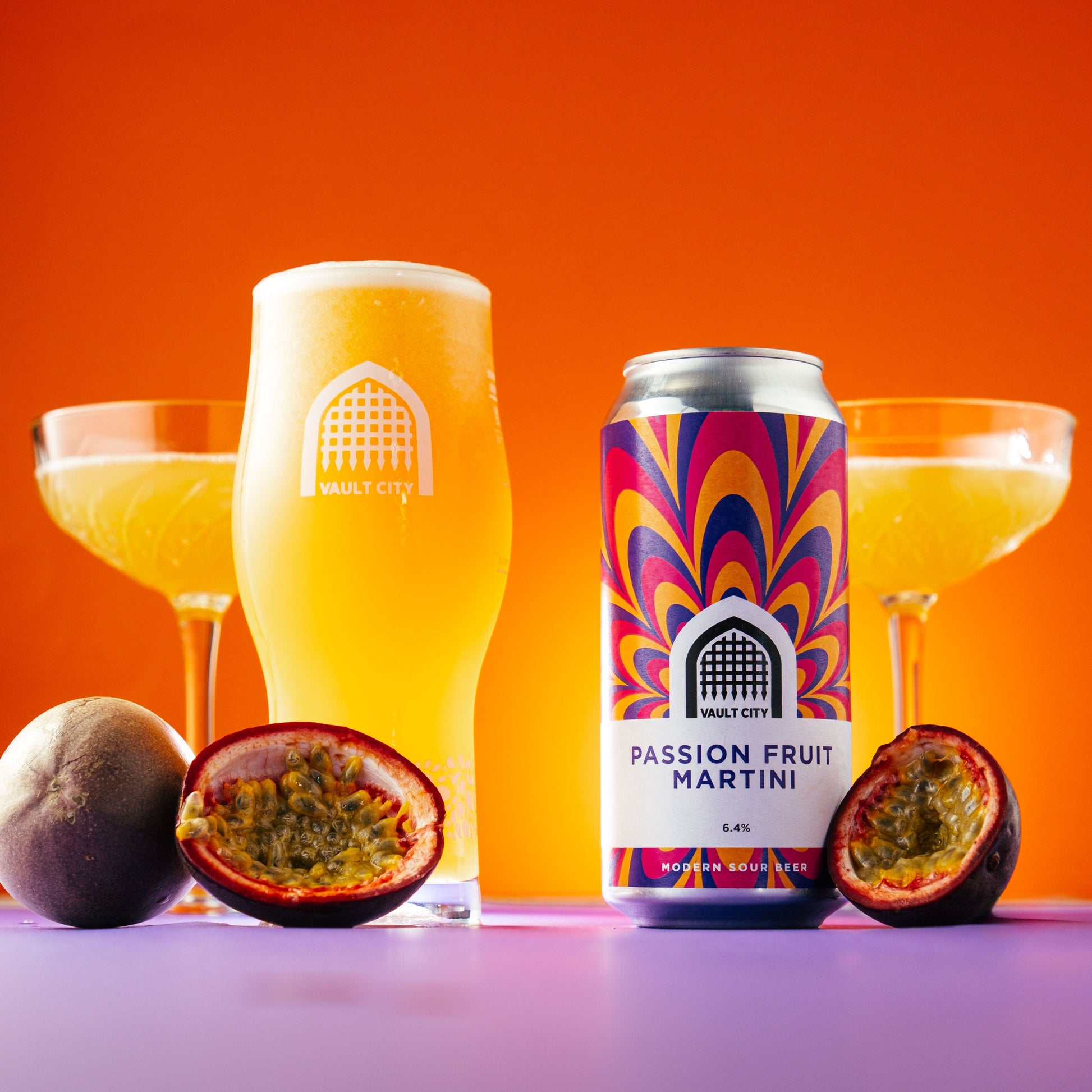 Passion Fruit Martini can and glass surrounded by fresh passion fruit, showcasing tropical flavors with vibrant orange background