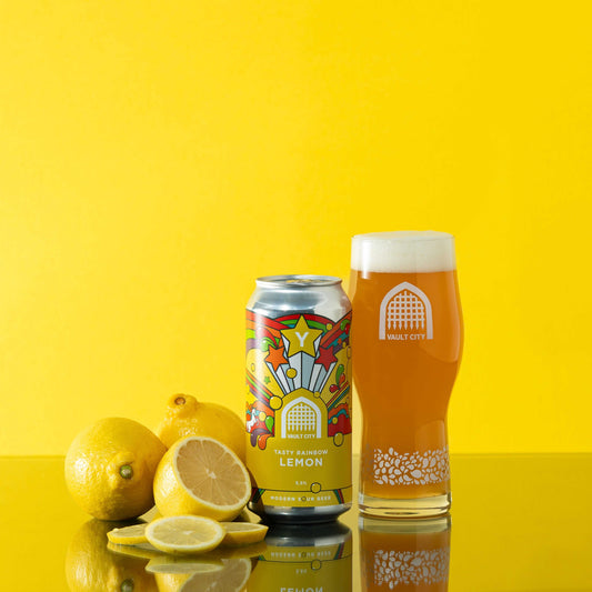 "Tasty Rainbow Lemon drink with vibrant zesty lemon flavor in a colorful can next to fresh lemons and a filled glass on yellow background"